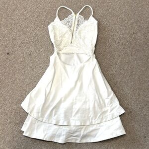 Cute little white dress,layered bottom,rayon,nylon. Excellent condition.XS